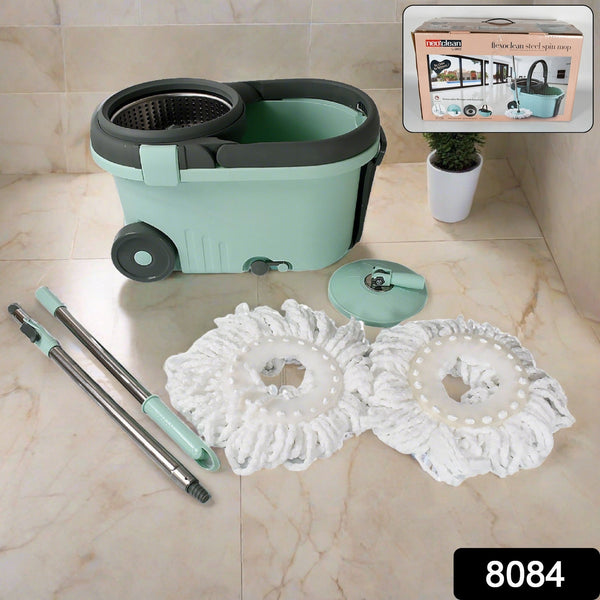 Close-up view of the Ganesh Spin Mop's microfiber head and adjustable stainless steel handle.