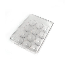 Hand placing an egg into the 12-cavity egg organiser for neat storage.