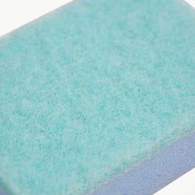 Textured surface of a robust cleaning sponge, designed for tough stains.