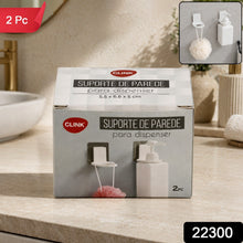 Two white plastic bottle holders with clear adhesive pads on a dark gray tiled wall next to a chrome faucet.