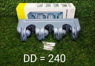 A blue three-slot wall-mounted mop and broom holder with screws, in front of its white and yellow packaging on green grass.