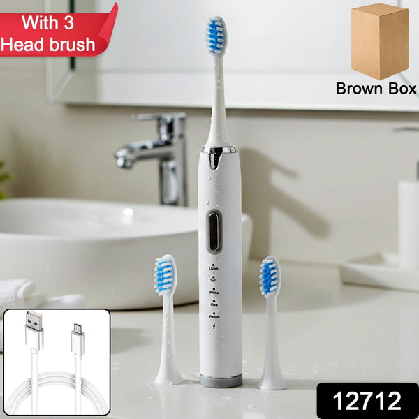 Electric toothbrush with ergonomic handle and soft bristle brush head attached