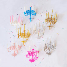 Overhead shot of the luxury birthday candles and stand, designed to be perfect cake toppers for any celebration.