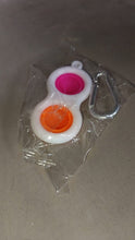 Pop It style fidget toy keychain, a fun sensory item.