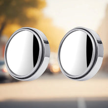 Silver round blind spot mirror on vehicle side mirror