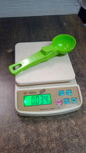Stylish green plastic ice cream scoop for easy storage.