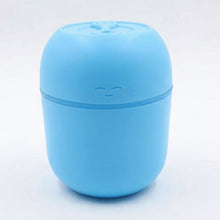Top-down view of the USB Air Humidifier, showing the water tank and control button.