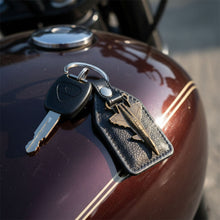 Compact aircraft design key holder with metal jet charm and leather finish