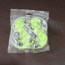 Lifestyle image of silicone pop it fidget toy in use for relaxation