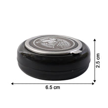 Tabletop ashtray showing deep container for ash collection