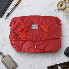 Exterior detail of stylish red travel carry bag