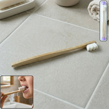 Wooden handle tooth cleaning brush