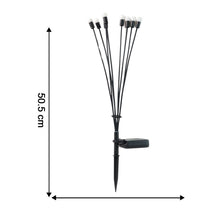 Ground stake solar LED garden light installed in lawn