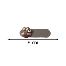 Neutral image showing size comparison of bunny face decorative hair clips