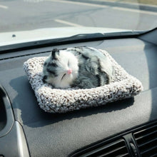 Adorable plush cat car ornament with a soft finish and closed eyes