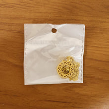 golden pendant with intricate patterns highlighting elegant design