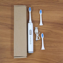 Complete electric toothbrush set in compact brown box packaging for gifting