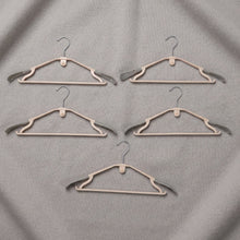 Sturdy plastic clothes hangers for daily wardrobe use