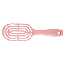 Men's hair brush held comfortably in hand, demonstrating easy grip.