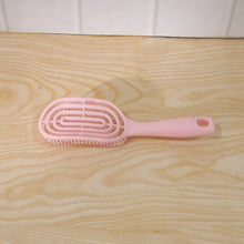Vented design of the hair brush assisting in faster blow-drying.
