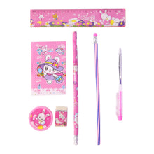 A pink rabbit-themed stationery set, including a ruler, notebook, two pencils, a pen, a sharpener, and an eraser, displayed