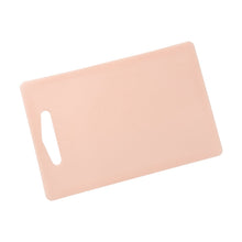 Close-up of kitchen cutting board with handle grip