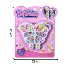 Assorted beads and charms in butterfly-shaped organizer tray
