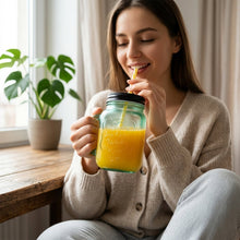 Close-up of the durable glass Mason Jar with Handle, showing the stainless steel lid and straw.