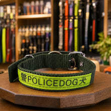 Heavy duty nylon dog collar with metal buckle and reflective stripe.