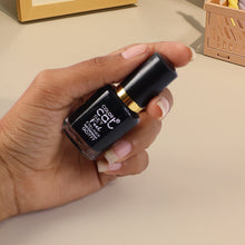 Eye definer using precision-tip waterproof eyeliner for clean lines.