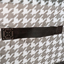 Detail shot of the canvas storage basket showing its reinforced steel support structure for durability.