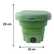 A green portable washing machine with its lid closed, displaying its dimensions of 29 cm in height and width with black