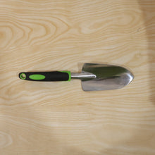 Garden tool in use for planting in flower bed
