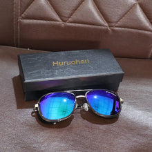 Lifestyle image of polarized aviator sunglasses being worn outdoors