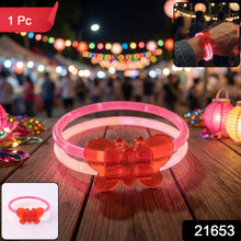 Close-up of butterfly shape on glow band bracelet glowing brightly