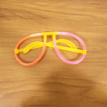 Live event with partygoers wearing glowing neon glasses