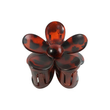 Top view of flower hair clip with visible claw mechanism