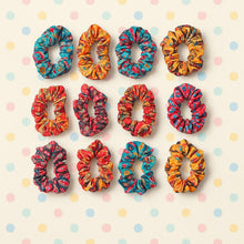 Assortment of vibrant fabric hair scrunchies in multiple prints