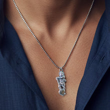 Side profile of the Hanuman Ji pendant, revealing the strong Gada motif.