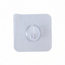 Plastic adhesive wall hook on wardrobe surface