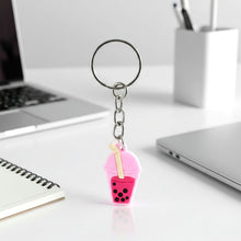 Bubble tea keychain displayed on a backpack zipper pull