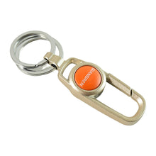 Metal keychain carabiner clip hanging securely from a bag strap