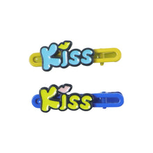 Fashionable hair accessories showcasing Kiss text snap clips