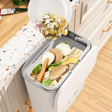 Side view of space-saving kitchen dustbin with lid