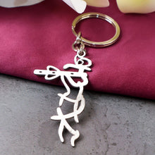 Krishna flute design stainless steel keychain with spiritual motif