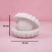 Front view of the glowing Pearl Shell Night Lamp, perfect for bedroom mood lighting.