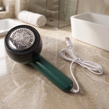 Detail view of electric lint remover device