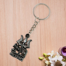 Close-up of Mahakal blessing engraved on the metal keychain