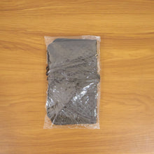 Lifestyle image featuring a user applying makeup with brush organizer bag nearby