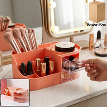 Pink cosmetic organizer with multiple compartments and brush holder